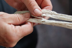 A close up of macrame in progress